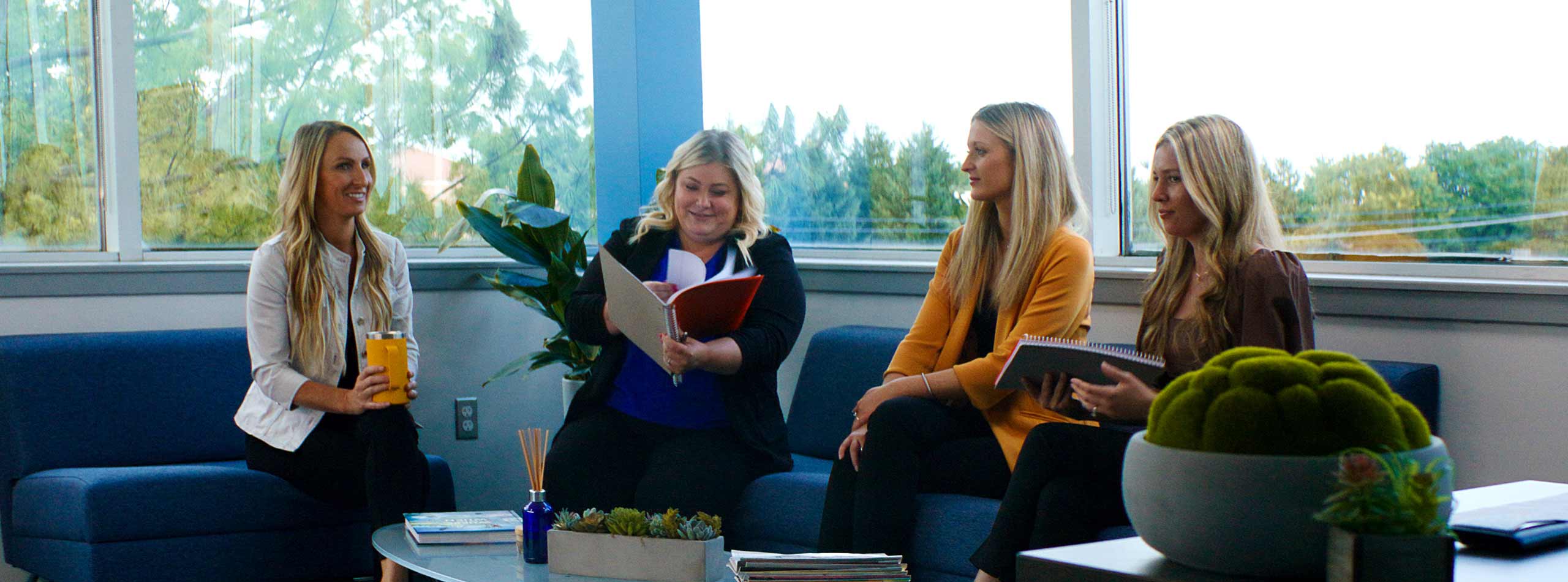 Caitlin Bailey, Stephanie Doherty, Lexi Rambo in seating area.