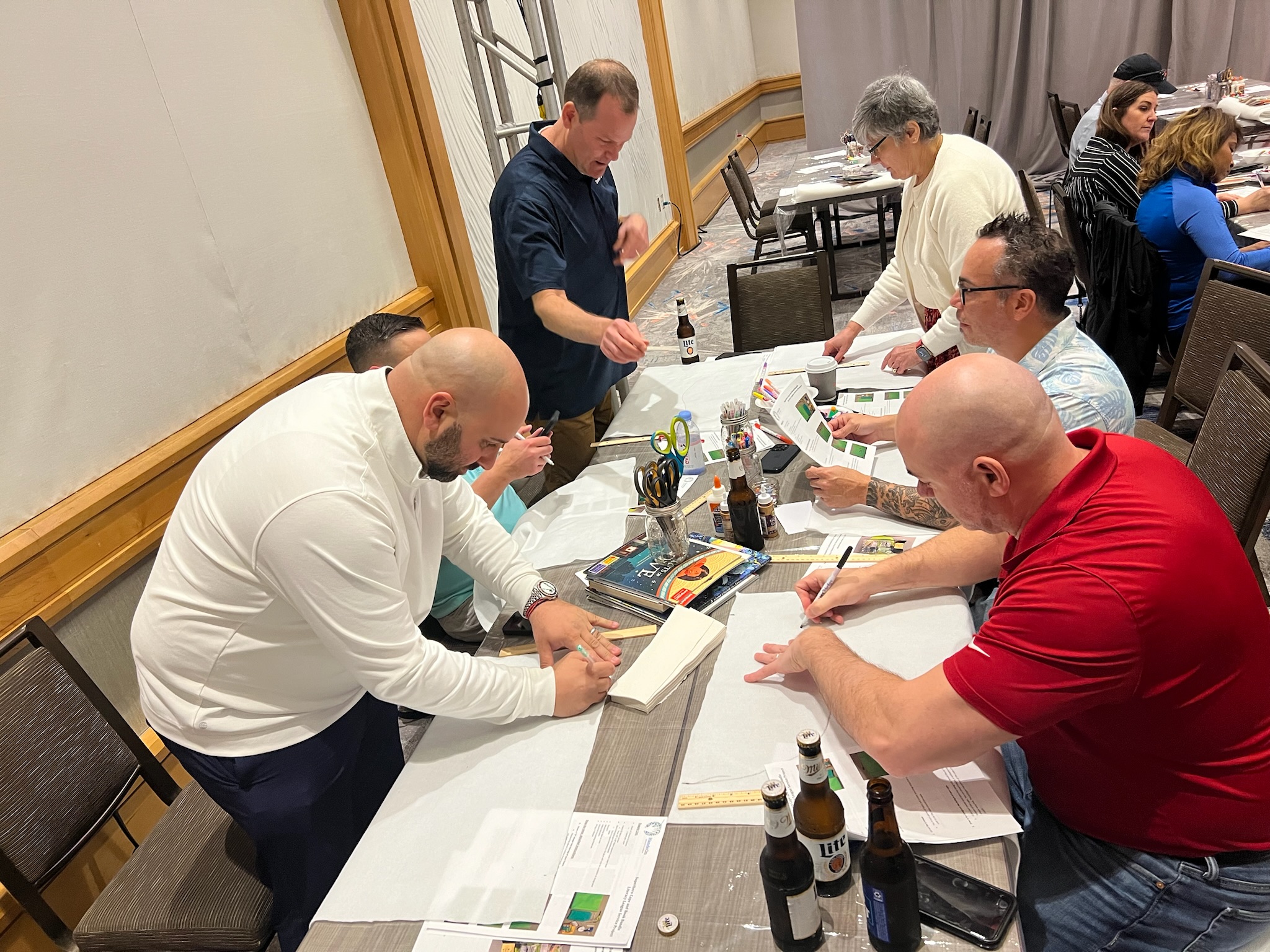 group photo of team members working together at Retiree First growth summit