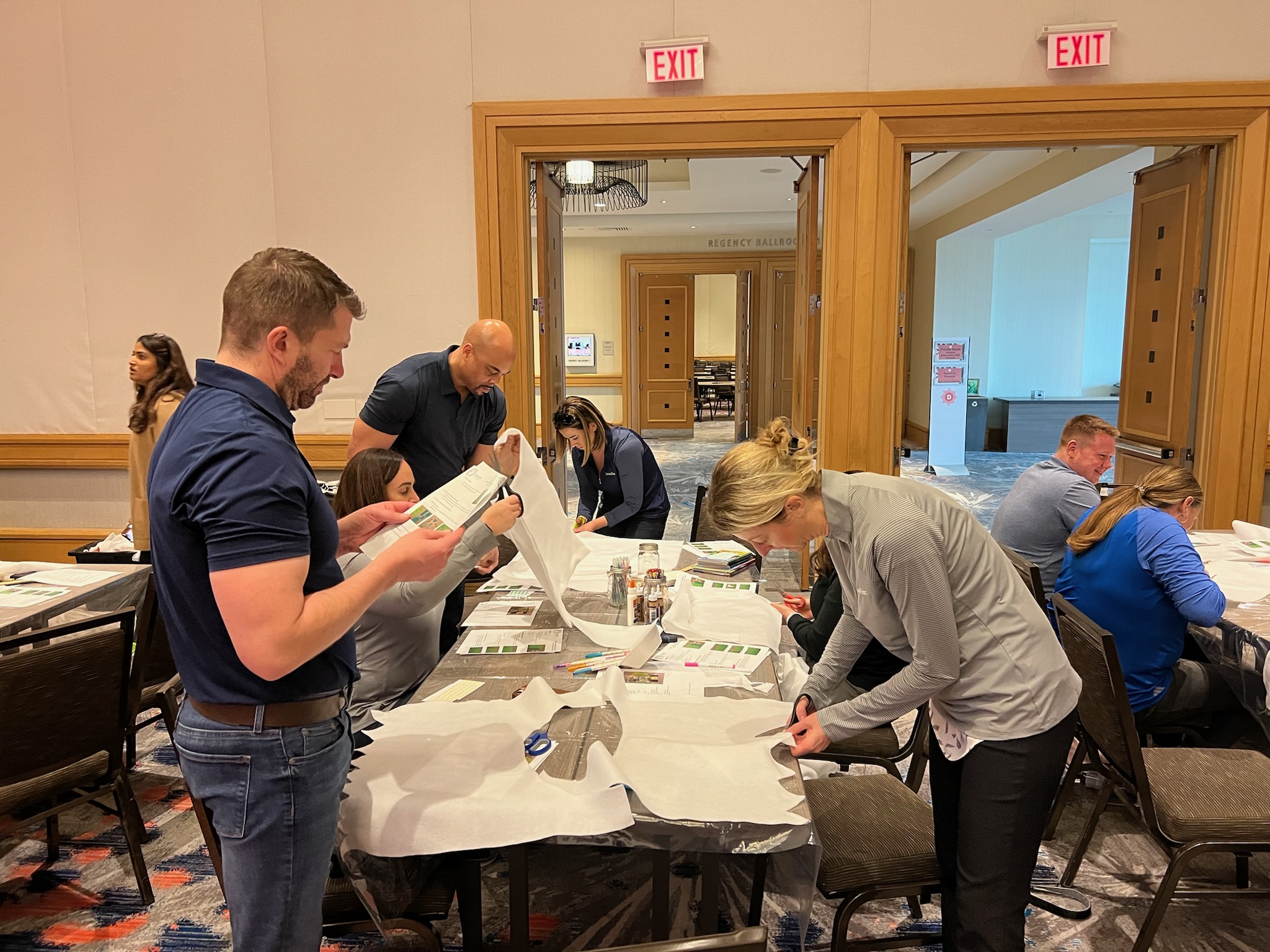 group photo of team members working together at Retiree First growth summit