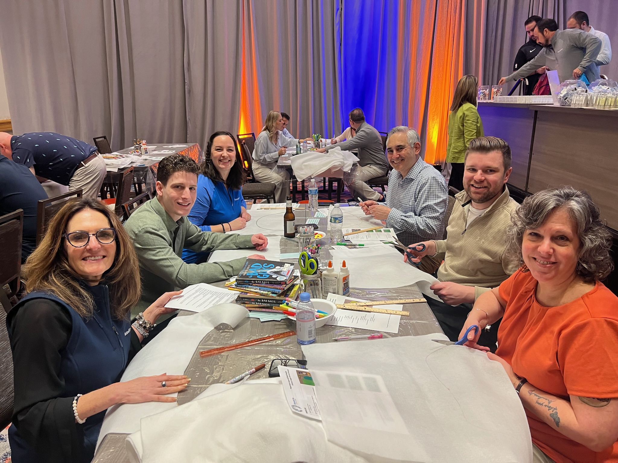 group photo of team members working together at Retiree First growth summit