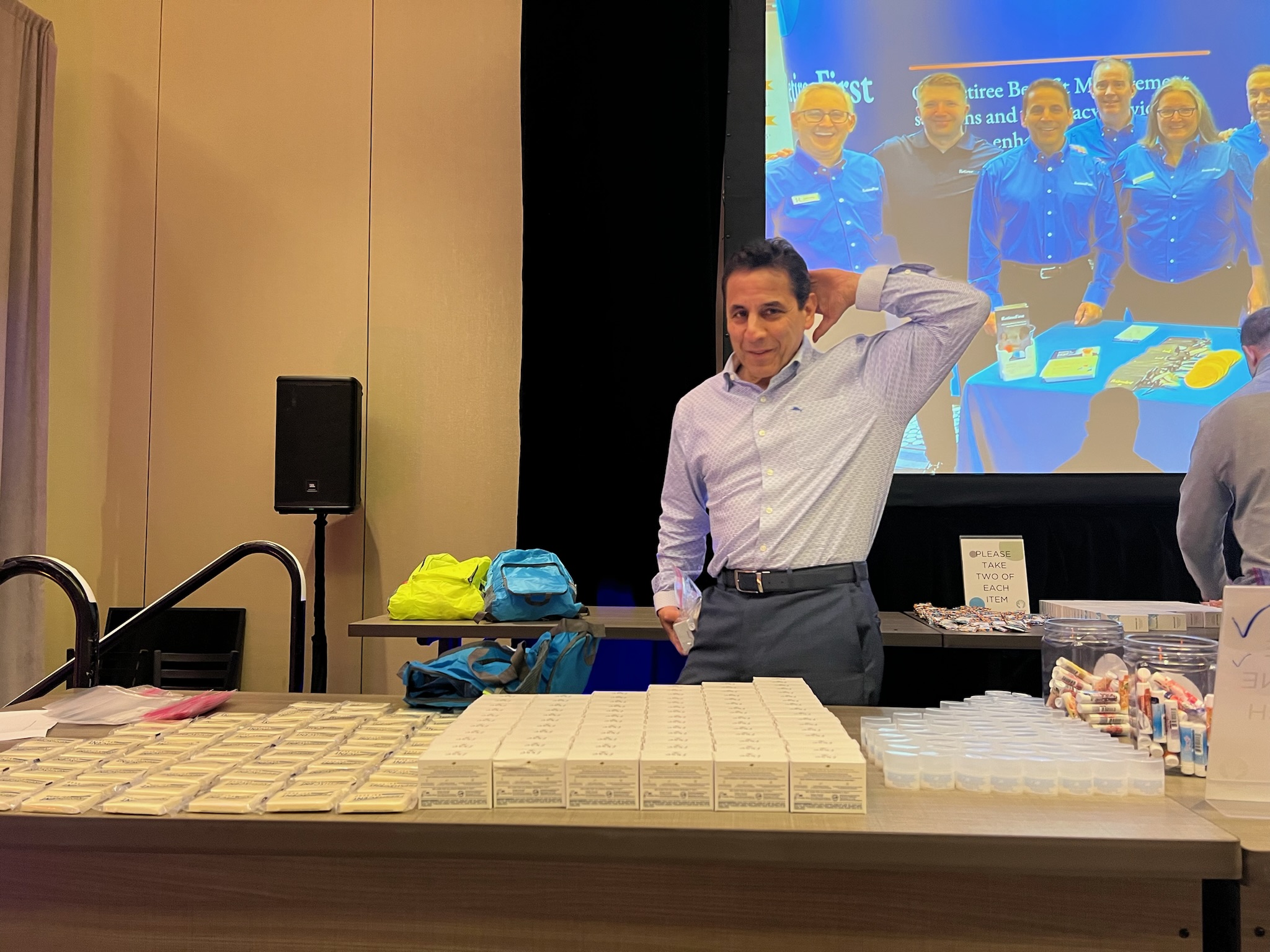 team member smiling at Retiree First growth summit