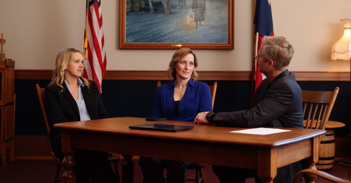 government officials talking together at a table