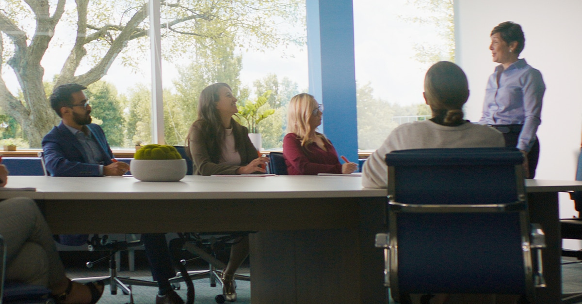 group of people at a conference table at work