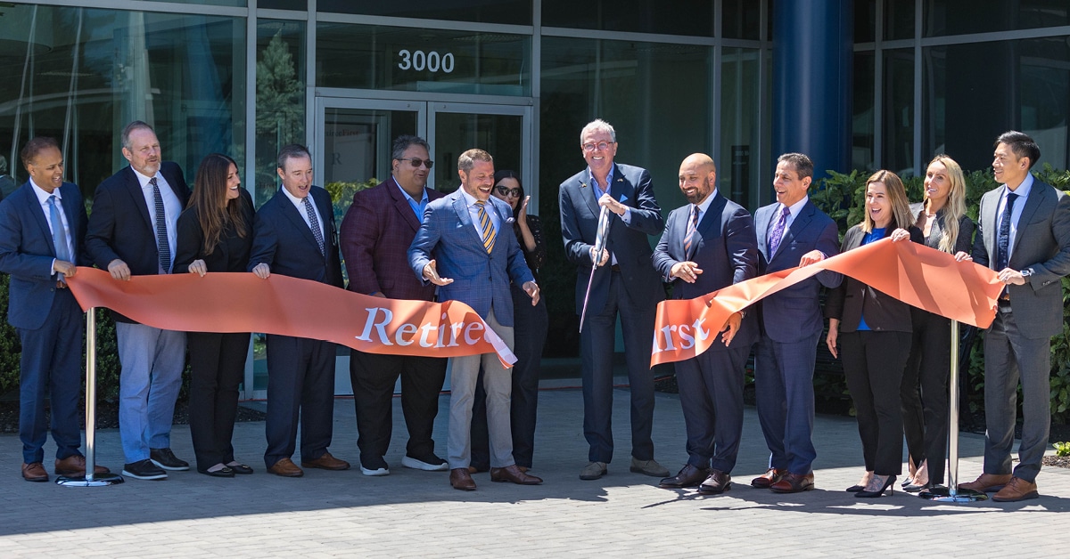 Retiree First group photo at a ribbon cutting ceremony