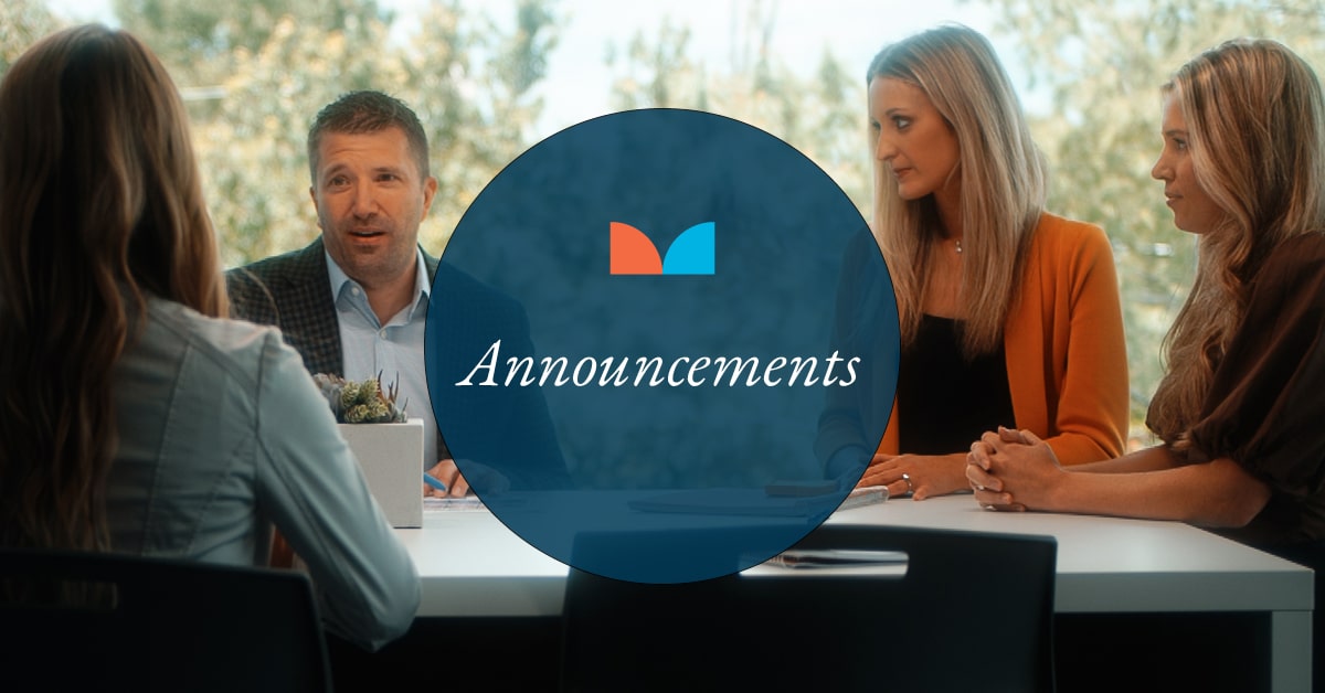 group of people sitting at a table together with a blue circle on top and the word announcements in it