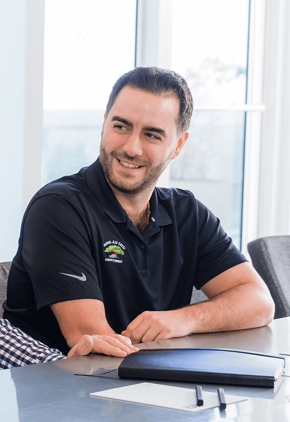 Man smiling in a conference room