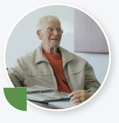 man wearing glasses and smiling