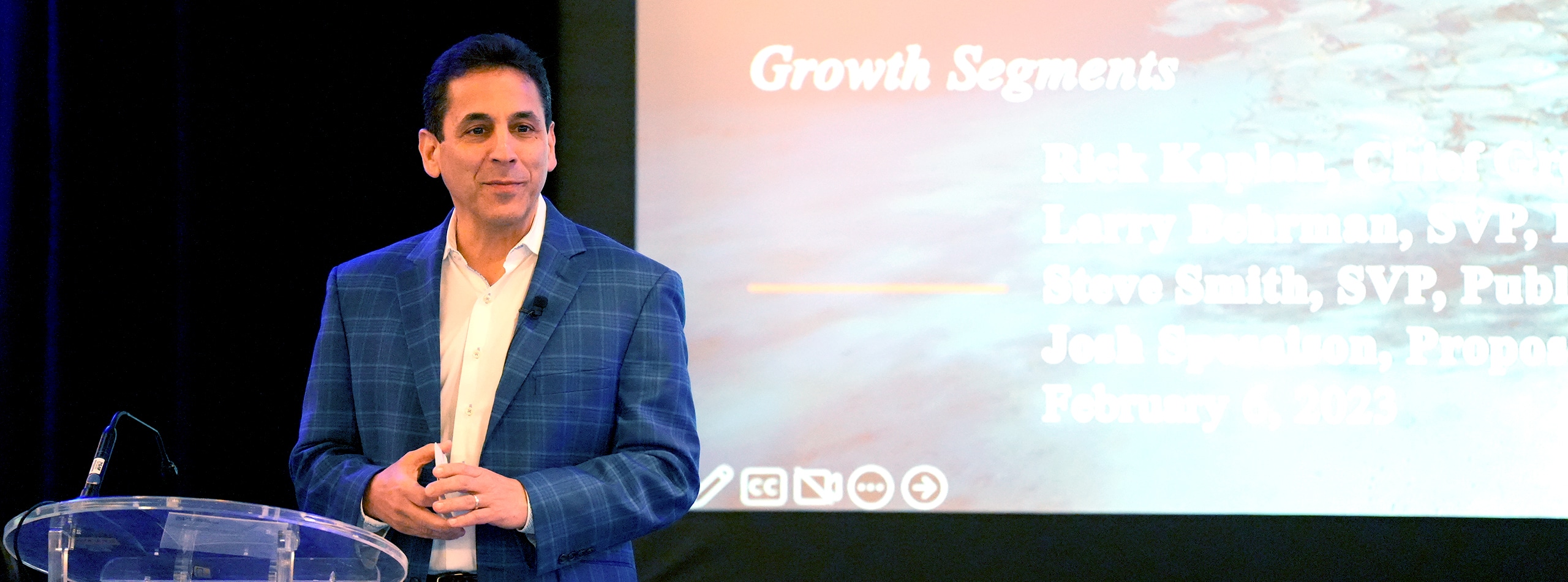 Rick Kaplan giving a presentation on a stage